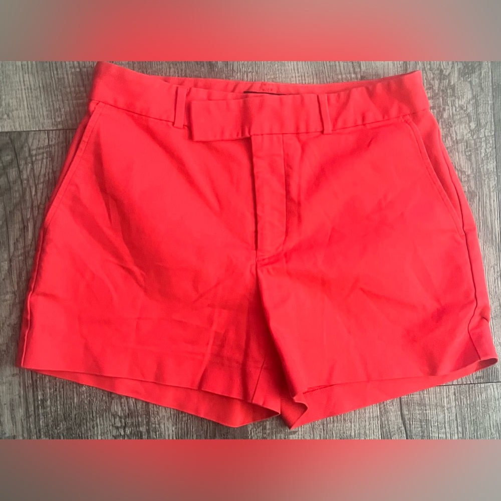 Lauren Ralph Lauren coral-colored shorts featuring a flat front design